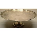 A mid eighteenth century silver footed salver, the centre engraved initials (small split) having a