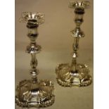 A pair of William IV/early Victorian Irish cast silver candlesticks, in mid eighteenth century