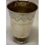 A French Louis XV silver beaker, with engraved shell foliage banded lip, the tuck in base on a