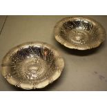 A pair of Arts and Crafts hammered silver dessert dishes, with repouse decoration of flowers and