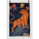 'The Night Watchman'. Tibetan tiger rug, inner Asia, mid-20th century, 5ft. X 3ft. 1in. 1.52m. X 0.