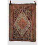 Senneh ghileem, north west Persia, early 20th century, 4ft. 10in. X 3ft. 5in. 1.47m. X 1.04m. Slight