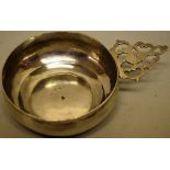 A Queen Anne Brittania standard silver bleeding bowl, the pierced fretwork handle with initials 'H &