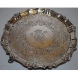 A George II silver circular salver, the centre engraved later with the armorial bearing of the