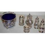 A silver sugar basket, with pierced fretwork ogee sides, fitted a blue glass liner, having a