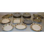 A French early nineteenth century porcelain part dessert service, gilt floral fluted rims,