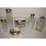 A George V set of two toilet bottles, an oval hair pin box, a hat pin tube and hair pin tube, with