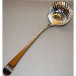 A George III silver Old English feather edge pattern soup ladle, engraved initials, with a shell