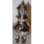 A Danish mid eighteenth century silver baluster caster, with rococo scroll chasing, a waisted