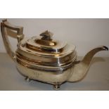 A George IV silver rectangular teapot, with ogee sides engraved initials, a swan neck spout,