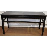 An eighteenth century Chinese ebonized wood alter table, the rectangular cleated frame plank top,