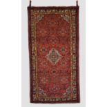 Hamadan rug, north west Persia, circa 1930s-40s, 7ft. 1in. x 3ft. 8in. 2.16m. x 1.12m. Red field