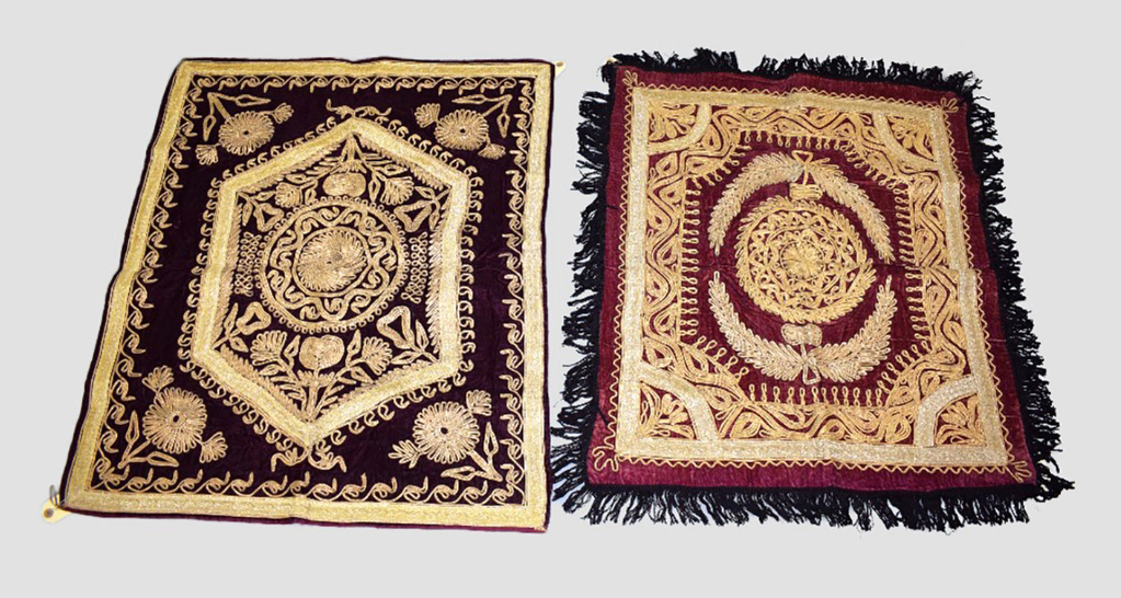 Two attractive Afghan red velvet metal thread embroidered dowry cloths, circa 1960s, each 33in. X