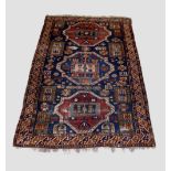 Shirvan three-medallion dated rug, south east Caucasus, early 20th century, 9ft. 3in. X 6ft. 3in.