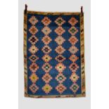 Fars gabbeh, south west Persia, mid-20th century, 5ft. 3in. X 3ft. 9in. 1.60m. X 1.14m. Shaded mid-