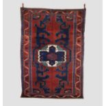 Kazak rug, south west Caucasus, circa 1920s, 8ft. 5in. X 5ft. 11in. 2.56m. X 1.80m. Dark earthy-