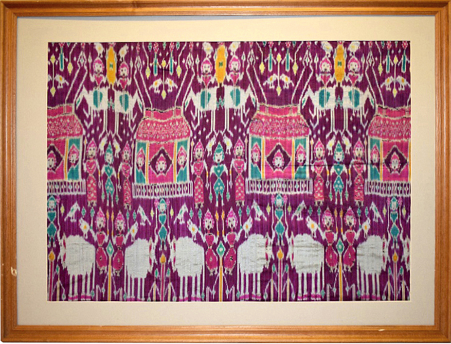 Rare large pictorial silk ikat fragment, depicting a row of pink and green tents across the centre