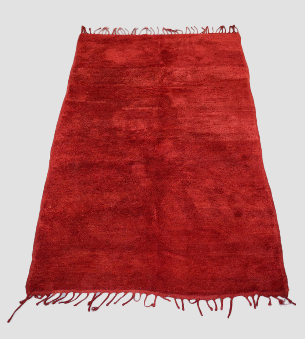 Plain red carpet by the Berbers of Morocco, mid-20th century, 9ft. X 5ft. 10in. 2.75m. X 1.78m. Long