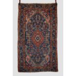 Kurdish rug, north west Persia, circa 1920s, 7ft. 4in. X 4ft. 3in. 2.24m. X 1.30m. Overall wear;
