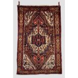 Hamadan rug, north west Persia, circa 1950s, 6ft. 7in. X 4ft. 2in. 2.01m. X 1.27m. Step-sided dark