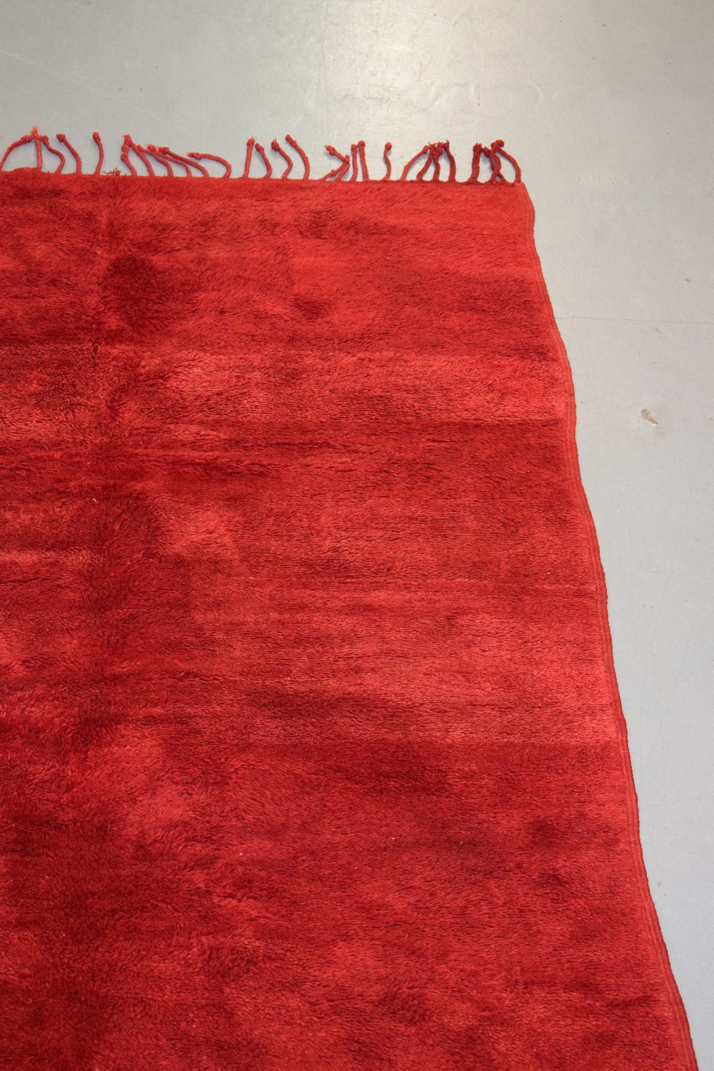 Plain red carpet by the Berbers of Morocco, mid-20th century, 9ft. X 5ft. 10in. 2.75m. X 1.78m. Long - Image 3 of 8