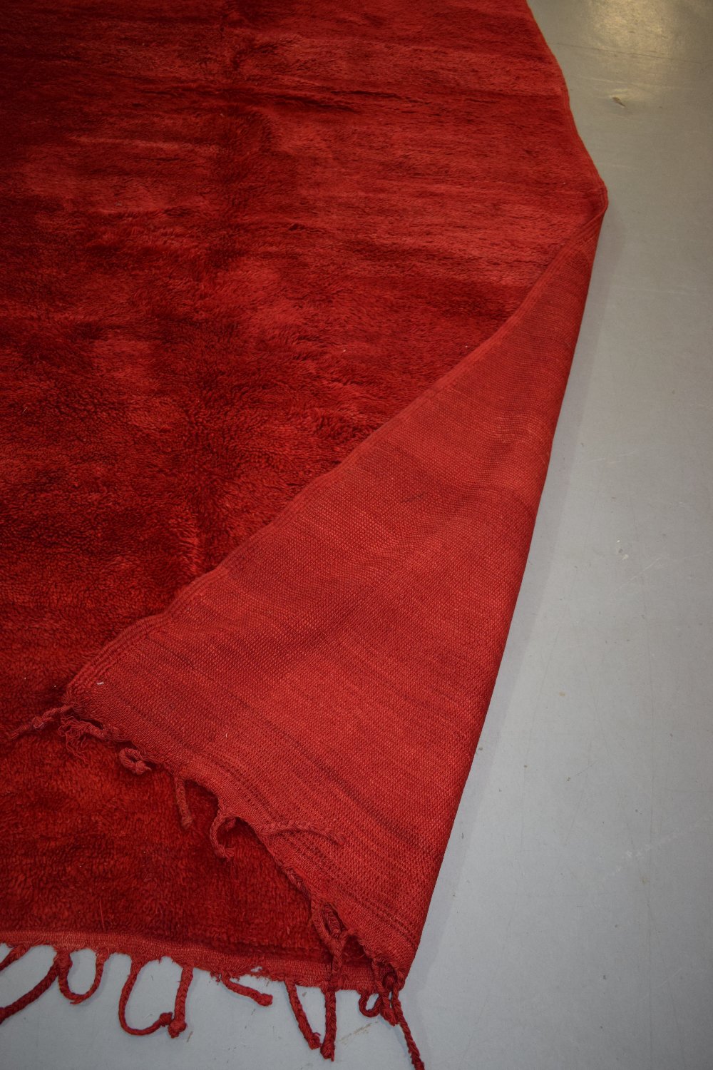 Plain red carpet by the Berbers of Morocco, mid-20th century, 9ft. X 5ft. 10in. 2.75m. X 1.78m. Long - Image 8 of 8