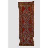 Two Ushak rugs, west Anatolia, early 20th century, the first a long rug, 8ft. 8in. X 3ft. 1in. 2.