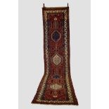 Attractive north west Persian runner, circa 1920s-30s, 14ft. 6in. X 3ft. 5in. 4.42m. X 1.04m. Slight