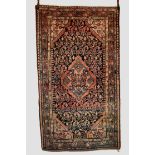 Hamadan rug, north west Persia, circa 1940s-50s; 7ft. 9in. X 4ft. 6in. Dark blue field with light