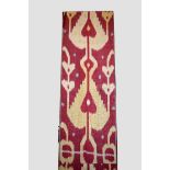 Attractive Uzbek silk ikat panel, Uzbekistan, probably early 20th century, mounted on a wooden