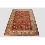 Tabriz carpet, north west Persia, mid-20th century, 14ft. 6in. x 10ft. 7in. 4.42m. x 3.23m. Dark red