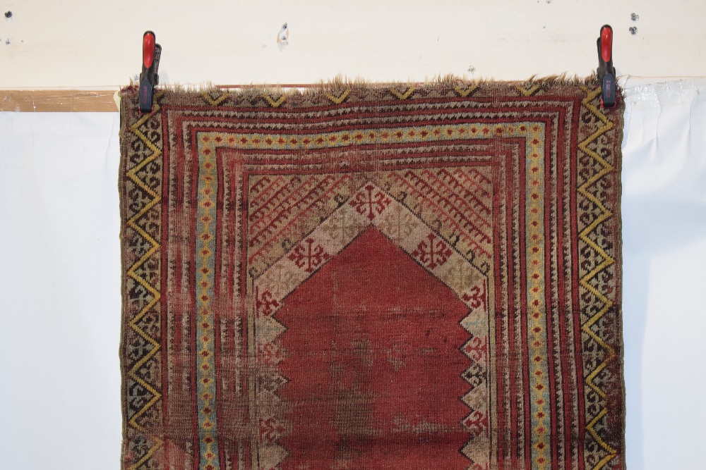 Four rugs comprising: the first, Anatolian prayer rug, probably Kirshehir district, early 20th - Image 3 of 29