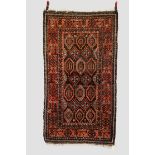 Two rugs, the first: Salar Khani Baluchi rug, north east Persia, circa 1920s-30s, 6ft. 7in. X 3ft.