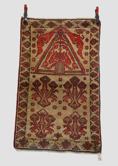 Four rugs comprising: the first, Anatolian prayer rug, probably Kirshehir district, early 20th