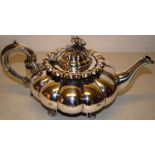 An early Victorian silver York teapot, melon panelled, with a swan neck spout, hinged domed cover