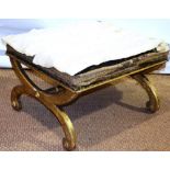 A Victorian giltwood mahogany 'X' frame stool, with a turned stretcher, a rectangular stuffed over