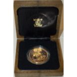 An Elizabeth 1988 gold five pounds piece, uncirculated, boxed.