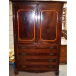 A William IV mahogany gentlemans wardrobe, with feather banding to the top with a detachable moulded