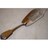 A William IV silver fiddle pattern fish slice, the handle engraved initials, the pierced fretwork