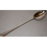 A George II silver large basting spoon, hanoverian pattern, engraved a winged parrot crest, 14in (