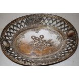 A late nineteenth century French Belle Epoque silver oval bread dish, the centre with two repouse
