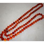 A long amber necklace approx 5ft (152cm) 1930's.