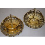 A pair of early Victorian silver gilt stands, the circular frames with later cut glass bowls, on