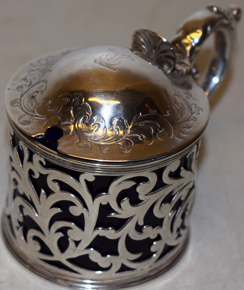 An early Victorian silver circular mustard pot, with pierced foliage fretwork sides, the domed