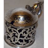 An early Victorian silver circular mustard pot, with pierced foliage fretwork sides, the domed