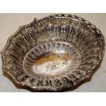 A George III oval silver sweetmeat basket with pierced fretwork and beaded sides, the centre