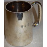 A silver pint mug with a 'C' scroll handle, the base inscribed, Maker Charles S Green & Co,