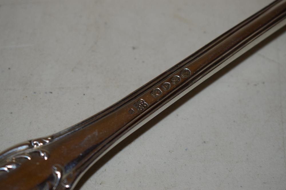 A Victorian silver basting spoon, husk variant pattern, with a recumbent stag crest, Makers - Image 2 of 2