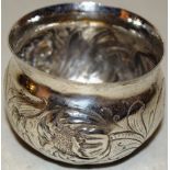 A mid seventeenth century Nurnberg silver tumbler cup, the sides with repousse foliage, 2.75in (7cm)