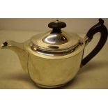 An unusual George III silver oval Argyle, having a scroll spout, the hinged cover with detachable